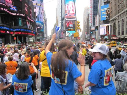 Hi-Five as Sami and Chloe see their photo on the Jumbo Tron